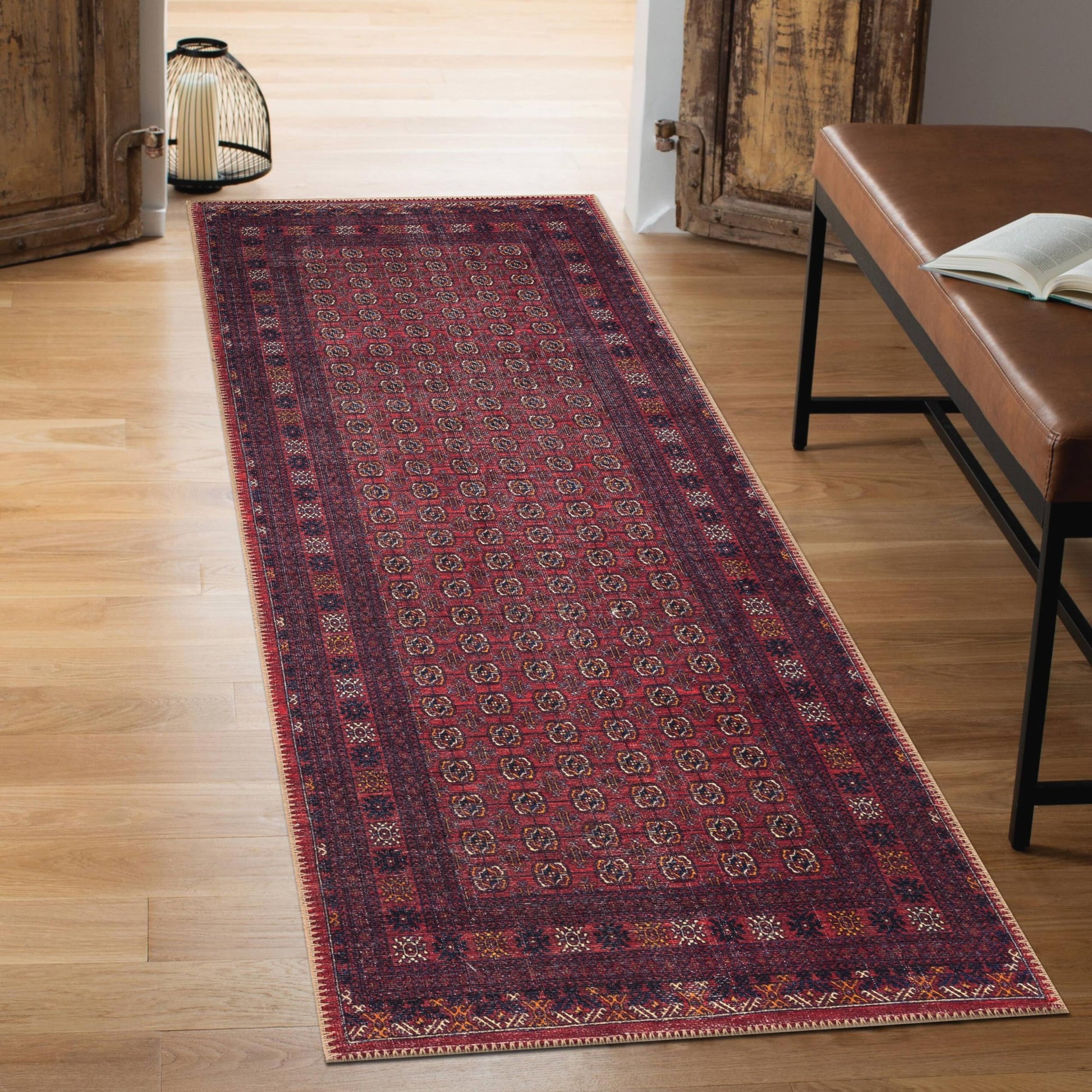 Close-up of the horizontal stripes and rosette motifs on the Afghan rug