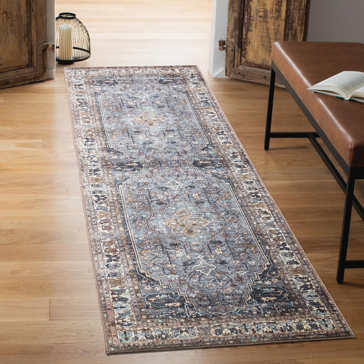 Close-up of the faded Heriz medallion in slate blue and taupe