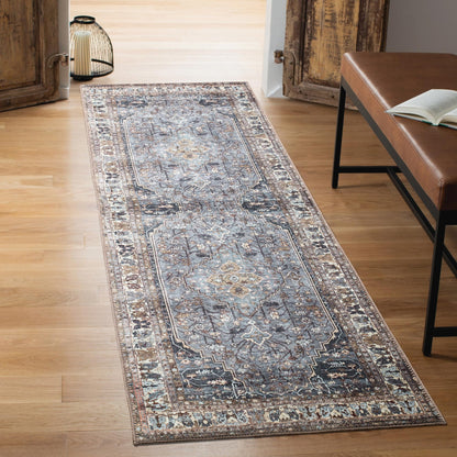 Close-up of the faded Heriz medallion in slate blue and taupe