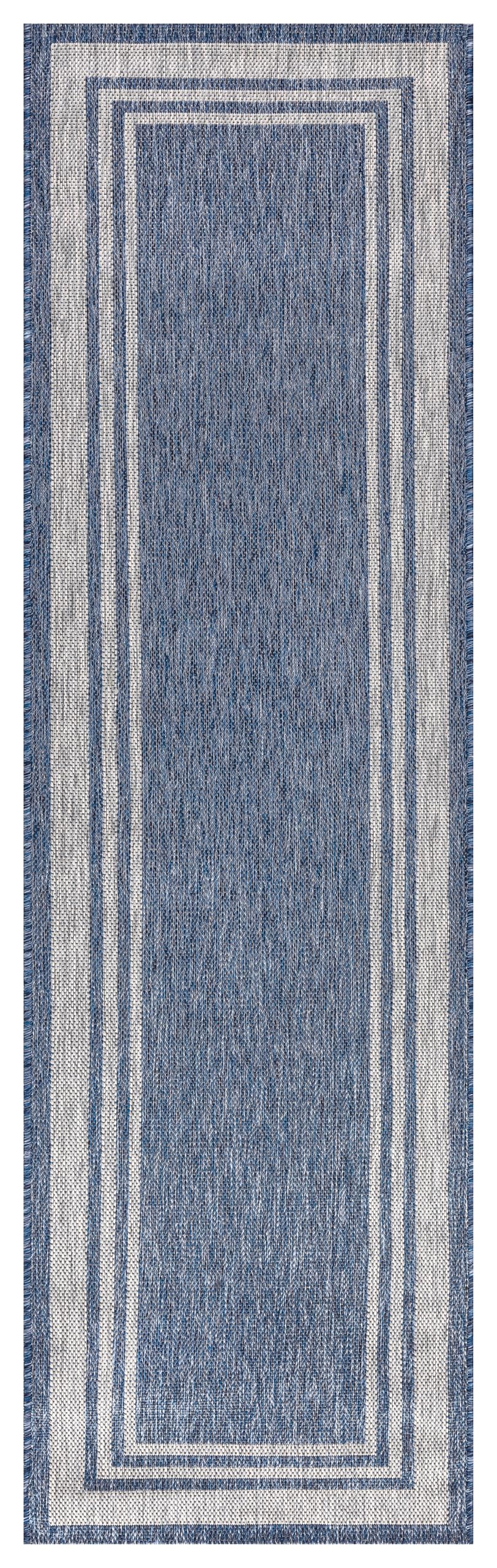 Close-up texture of the navy field and ivory border weave