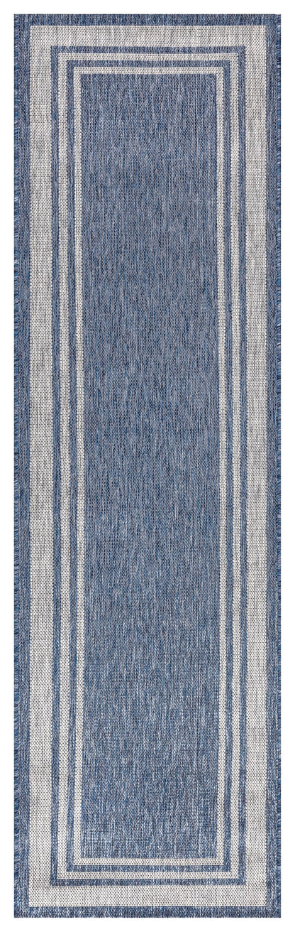Close-up texture of the navy field and ivory border weave
