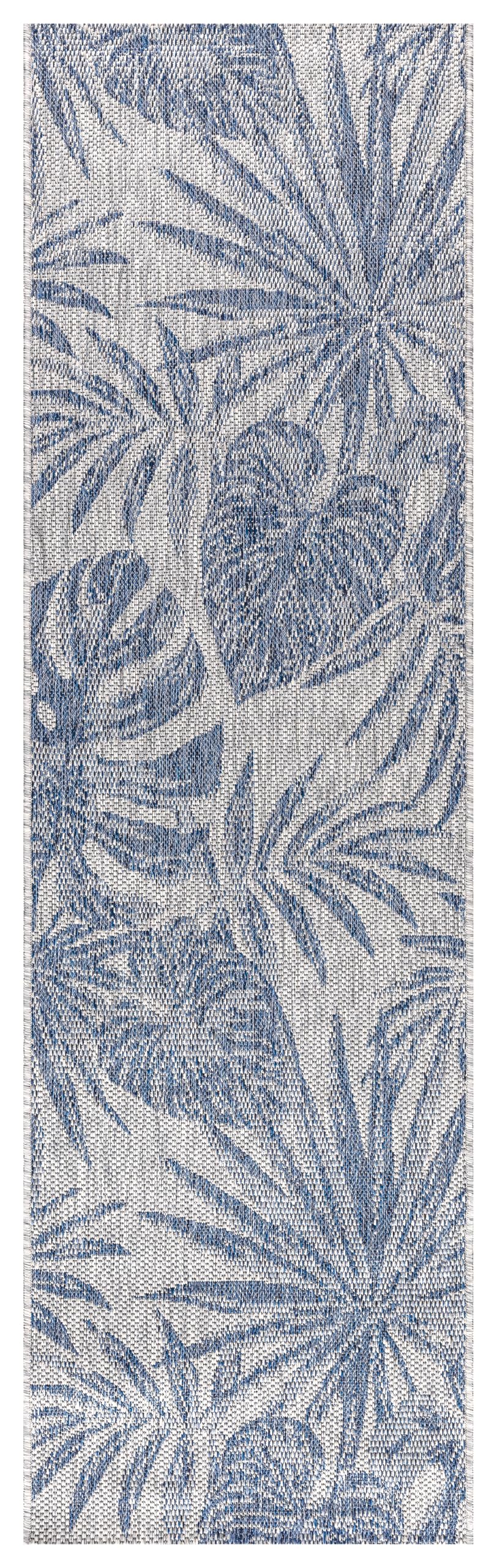 Close-up texture of the navy monstera leaves on ivory ground