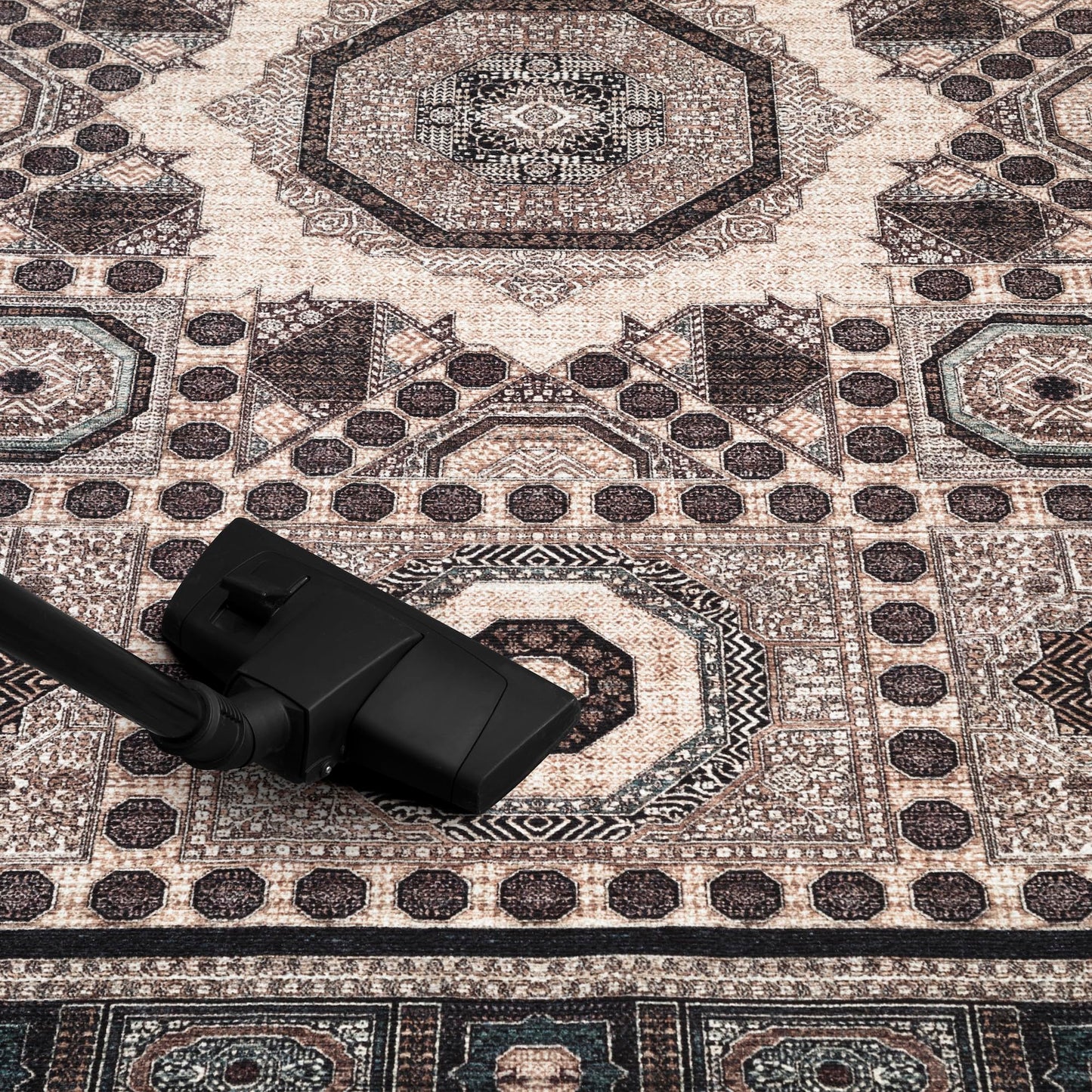 Geometric Mamluk rug in a home library with leather chairs