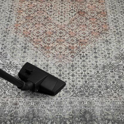 Refined Senneh rug in a home library with leather chair