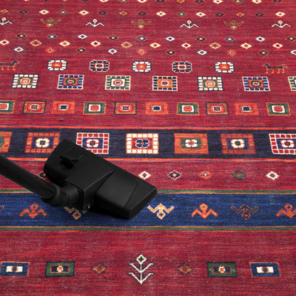Heritage Afghan rug in a reading nook with armchair