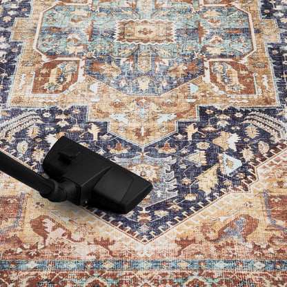 Navy and rust Heriz rug in a heritage library with leather chairs