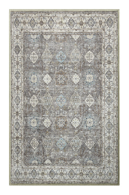 Soft blue Oushak rug in a designer reading nook with armchair