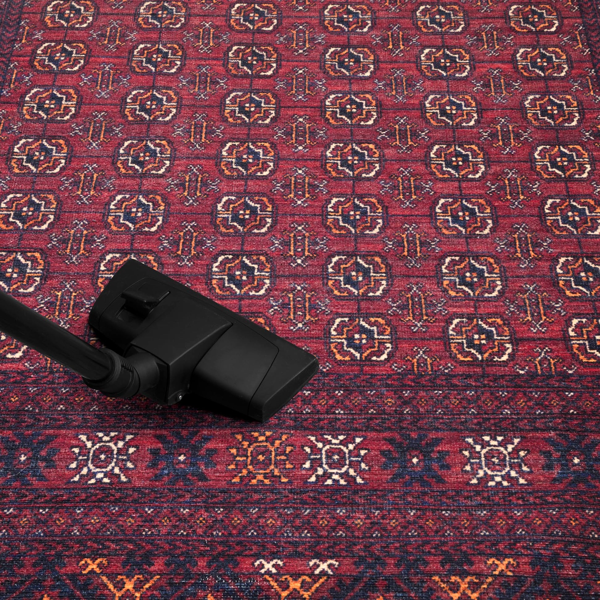 Tribal striped rug in a reading nook with leather chair