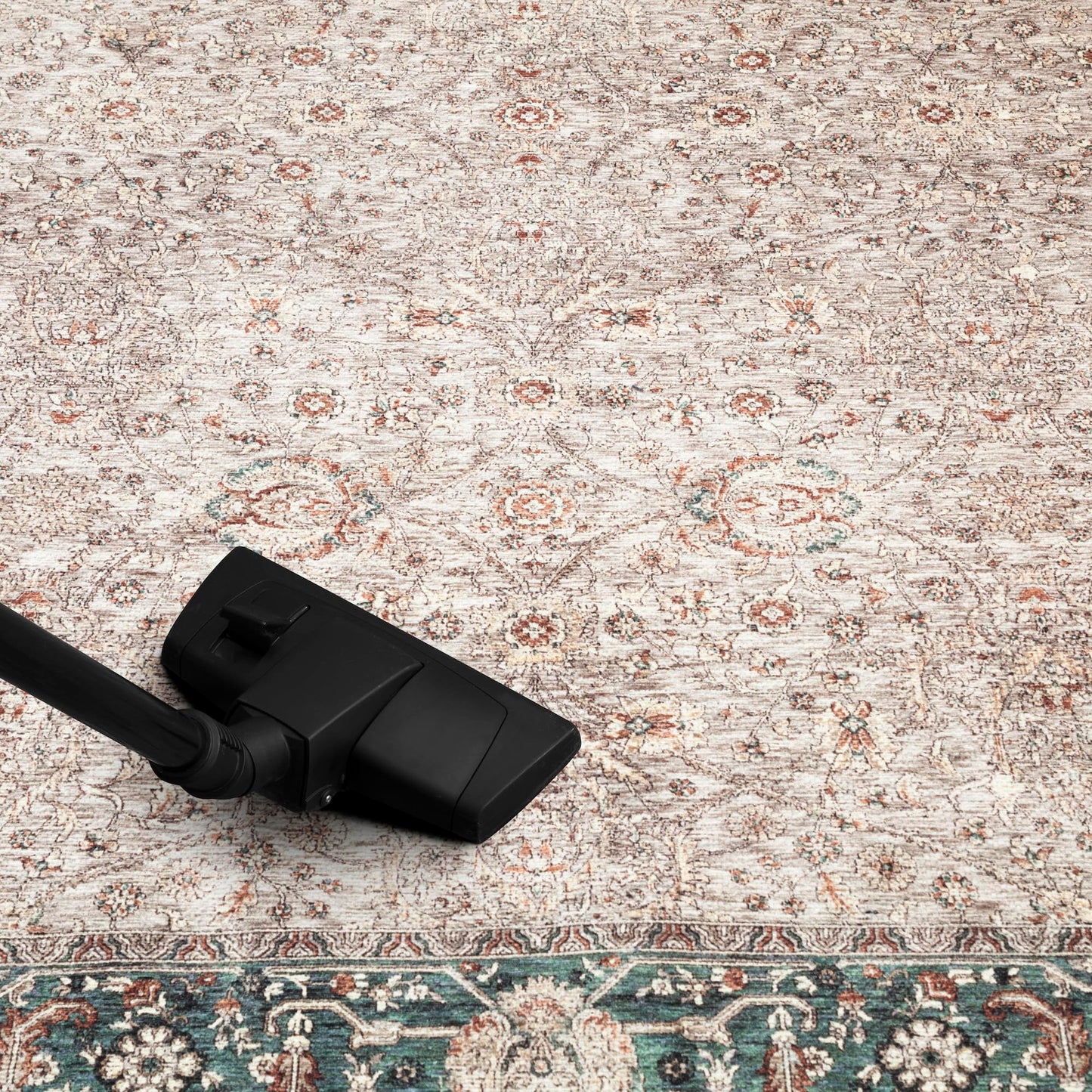 Refined Nain rug in a collected home library with leather chairs
