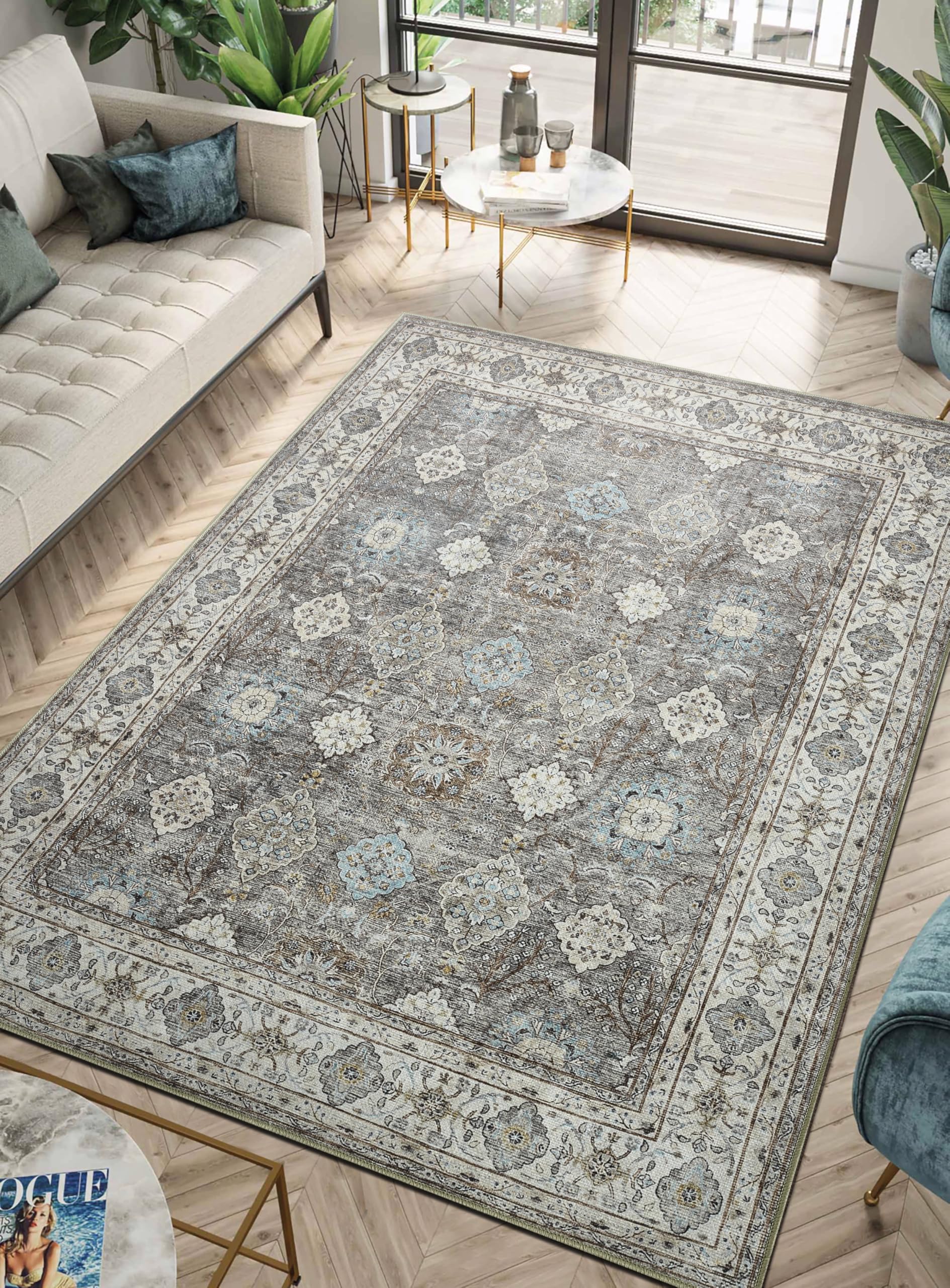 Oushak Turkish rug under a white slipcovered sofa with linen pillows