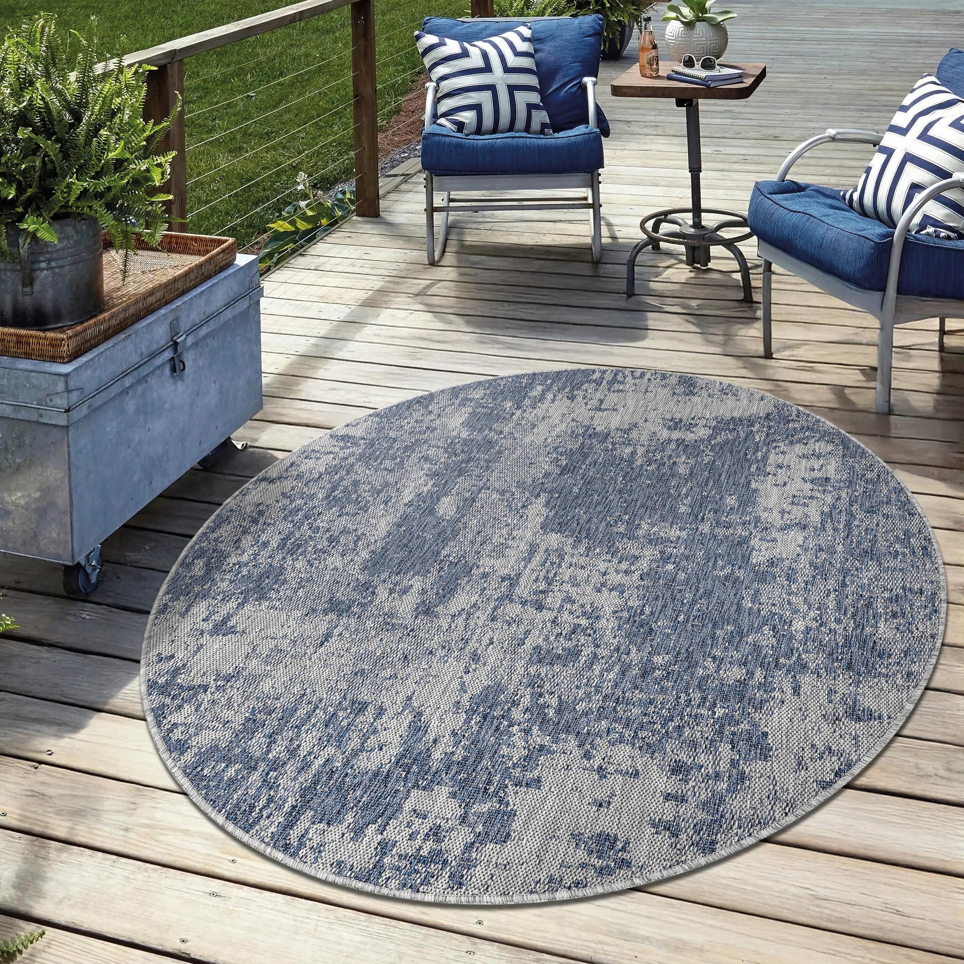 Navy weatherproof rug on cedar deck with lounge chairs