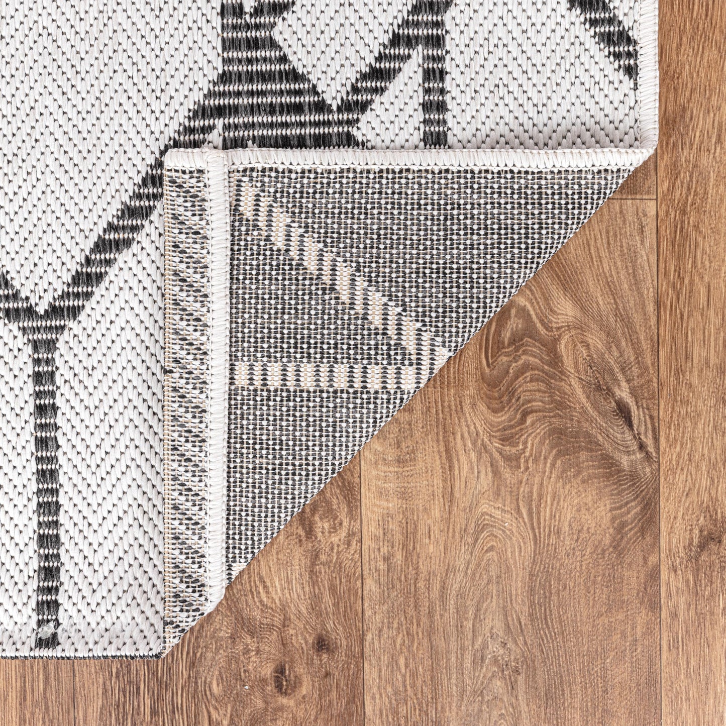 Art Deco geometric weatherproof rug beside swimming pool