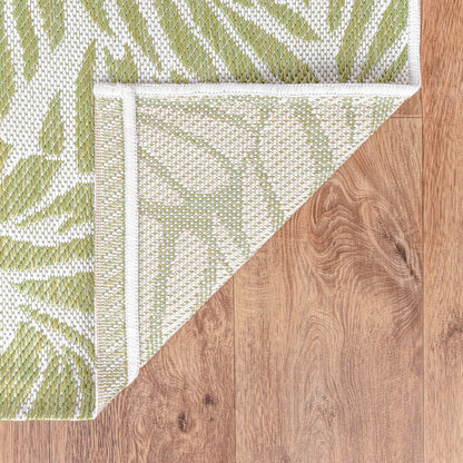 Tropical leaf weatherproof rug beside swimming pool