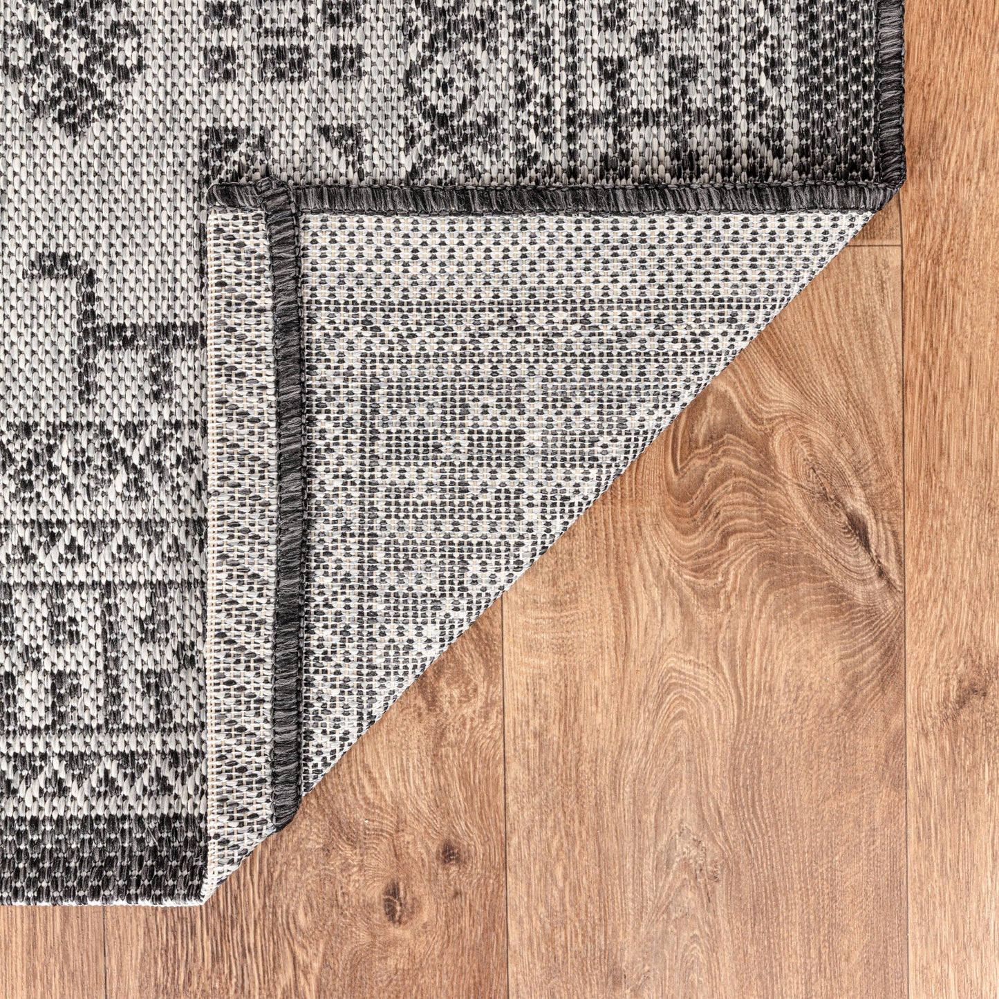 Tribal heritage weatherproof rug beside swimming pool