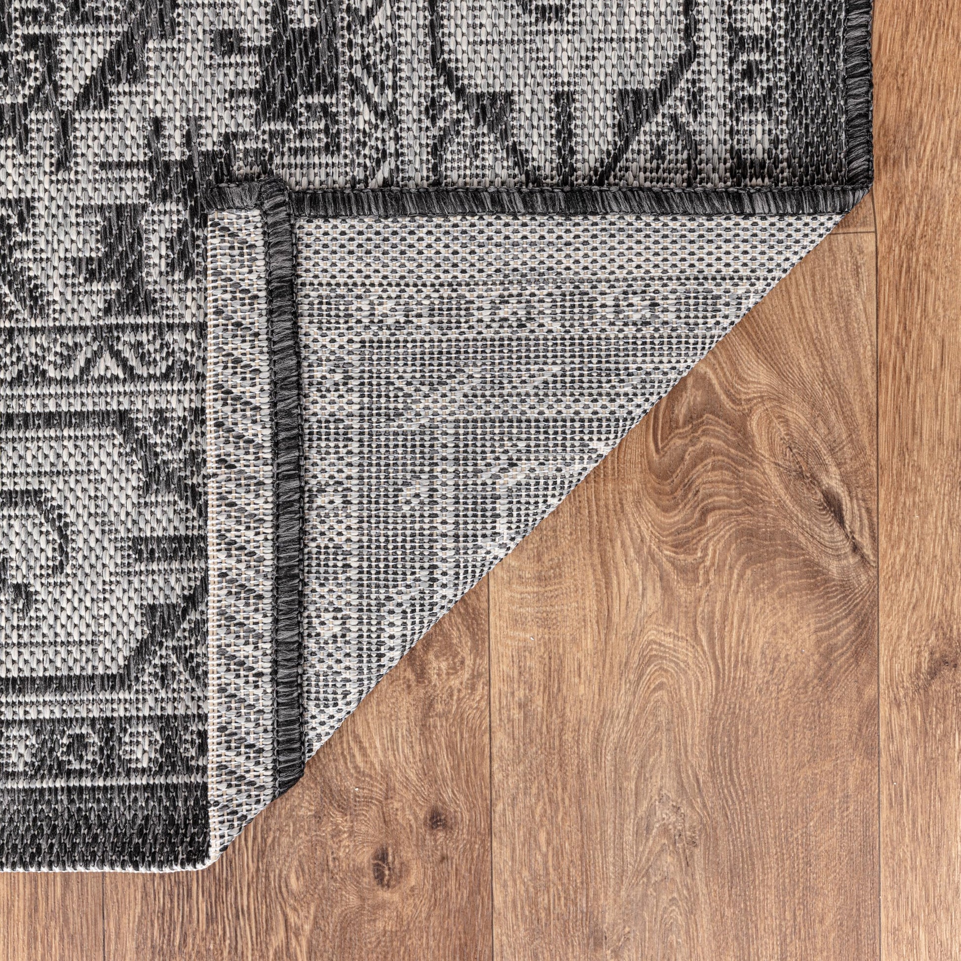 Persian medallion weatherproof rug beside swimming pool