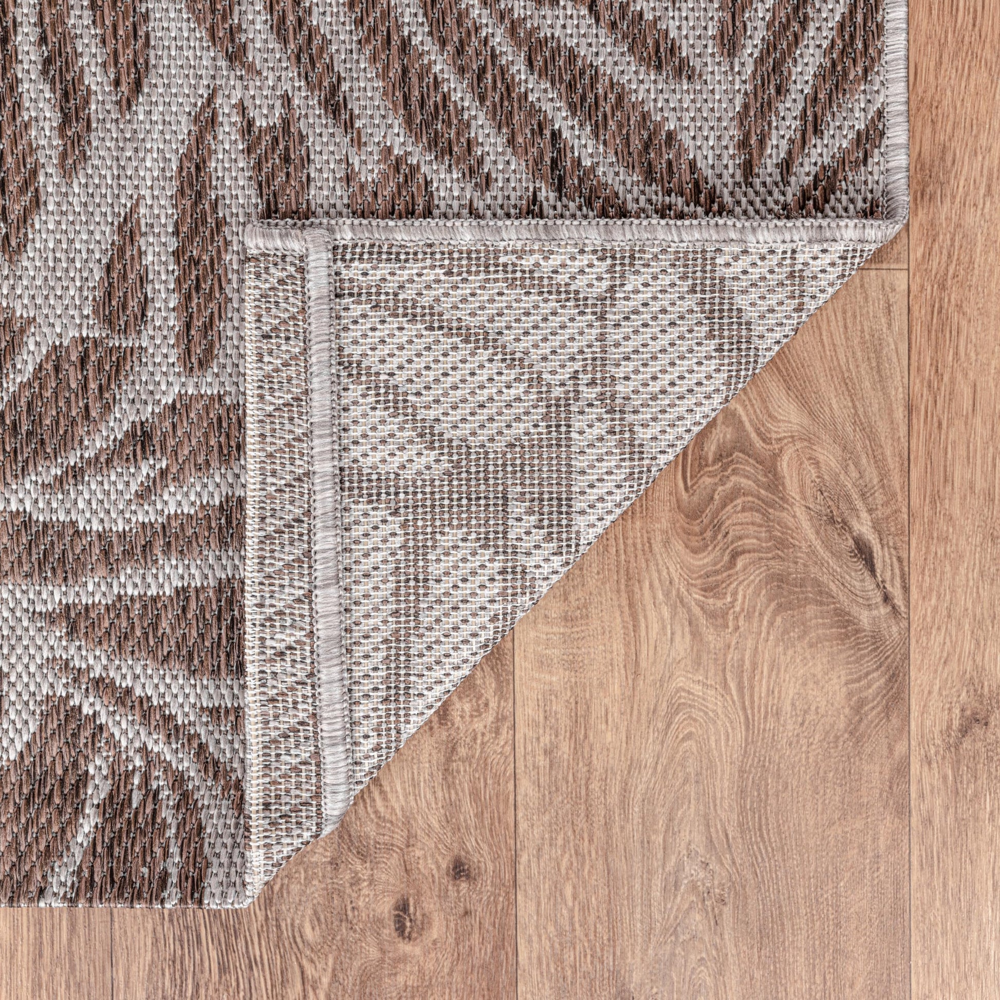 Tropical leaf weatherproof rug beside swimming pool