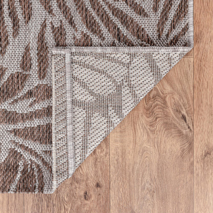 Tropical leaf weatherproof rug beside swimming pool