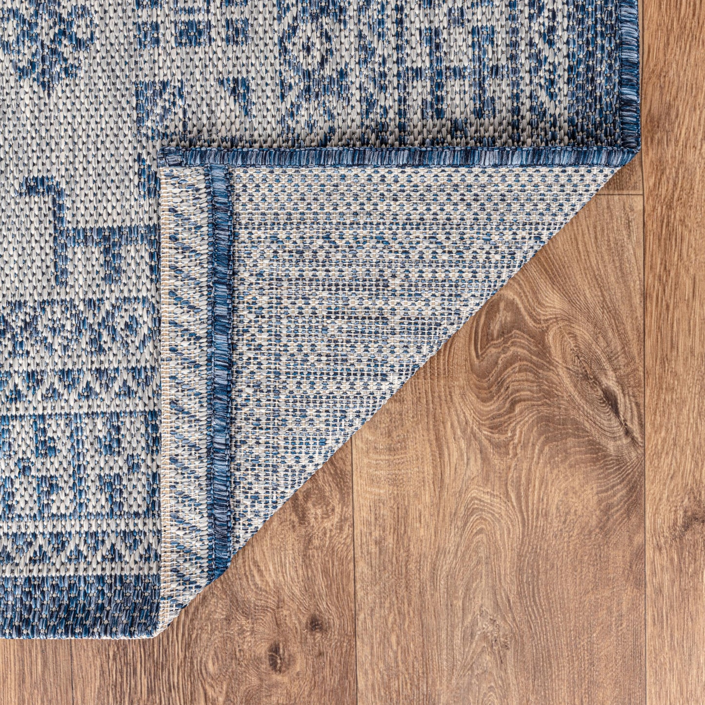 Tribal heritage weatherproof rug beside swimming pool