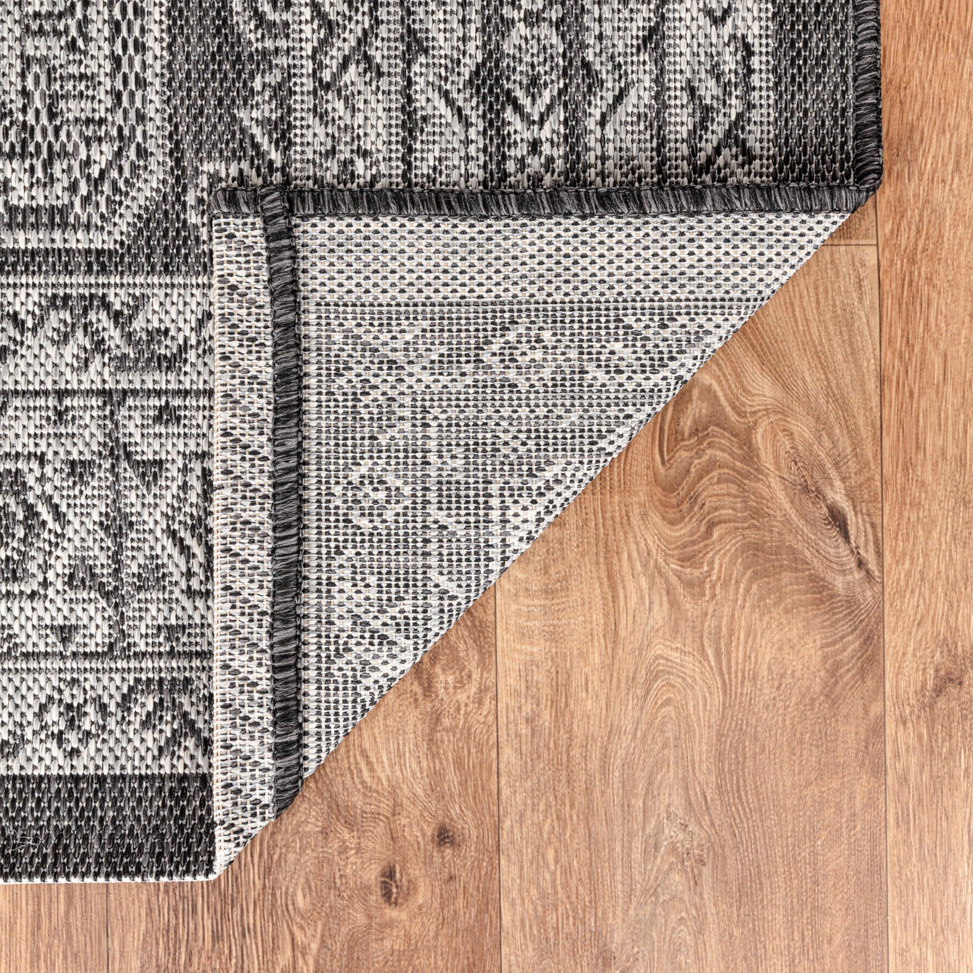 Anatolian medallion weatherproof rug beside swimming pool