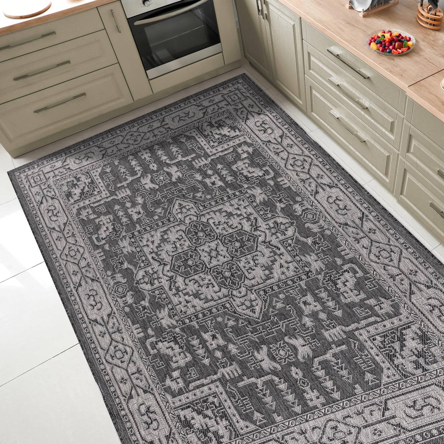 Persian medallion outdoor rug under round patio dining table