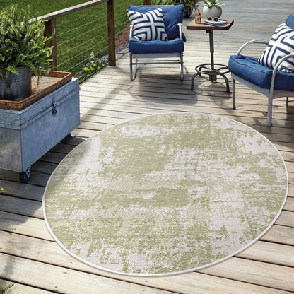 Green weatherproof rug on cedar deck with lounge chairs