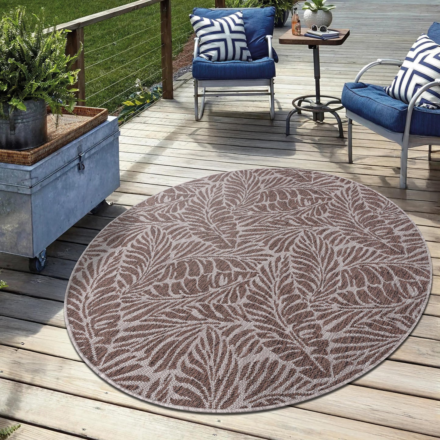 Brown weatherproof botanical rug on cedar deck with lounge chairs