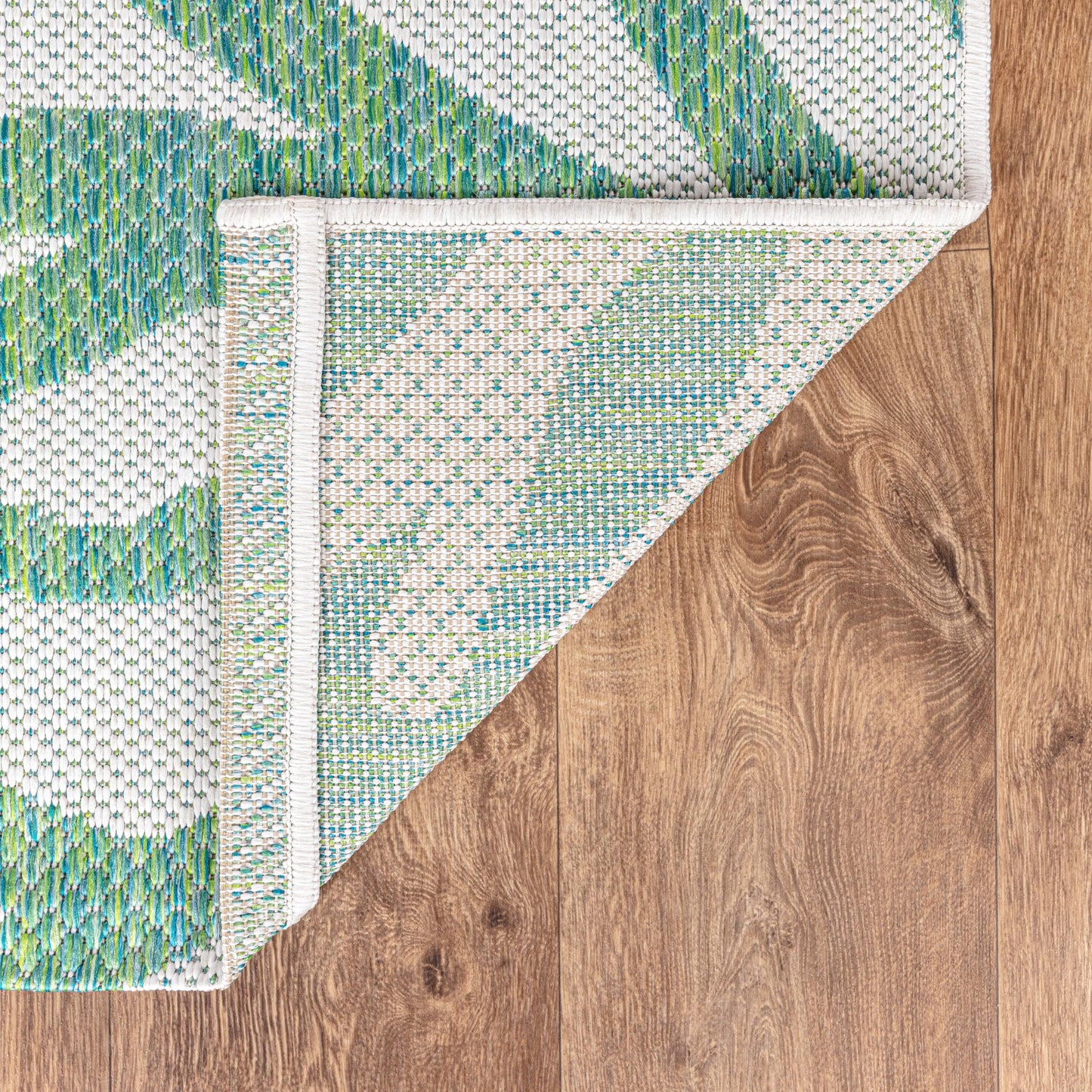Coral pattern weatherproof rug beside swimming pool