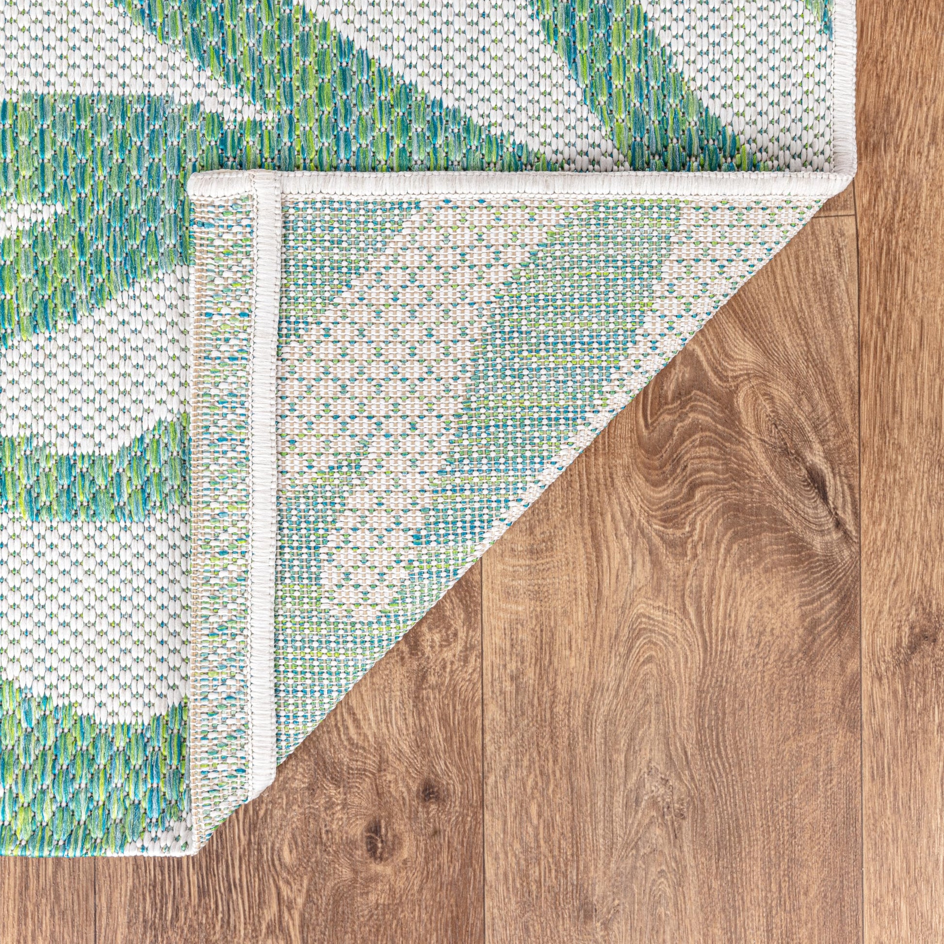 Coral pattern weatherproof rug beside swimming pool