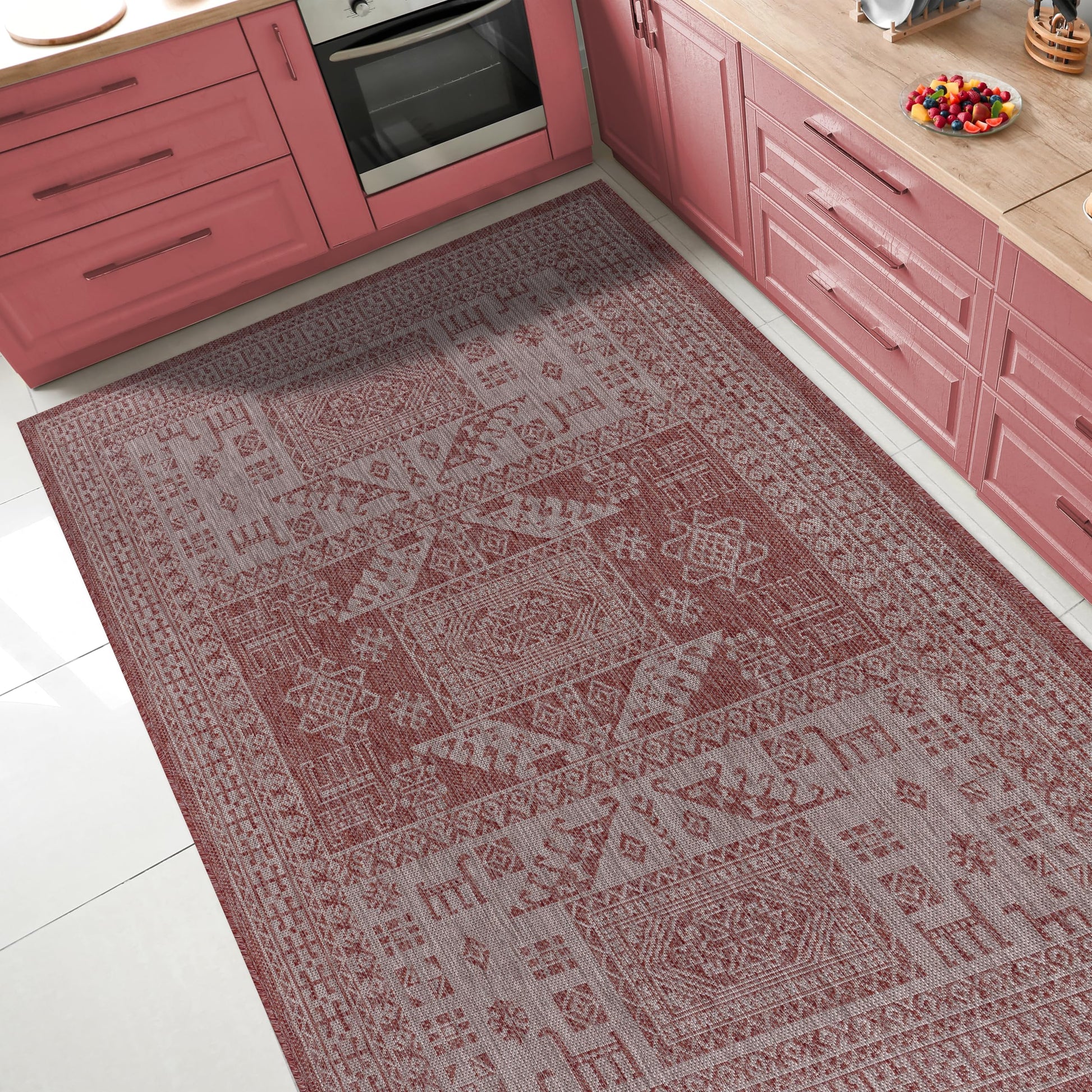 Tribal heritage outdoor rug under round patio dining table