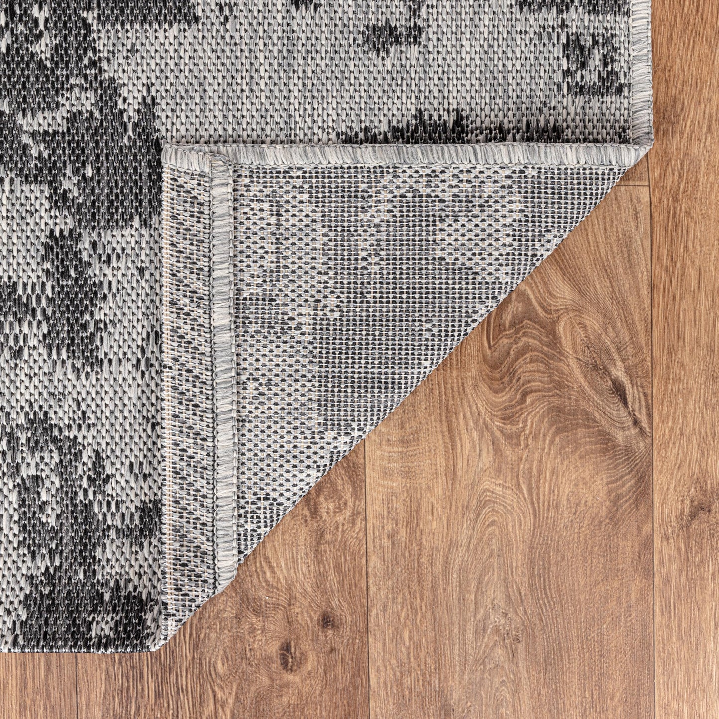 Modern abstract weatherproof rug beside swimming pool