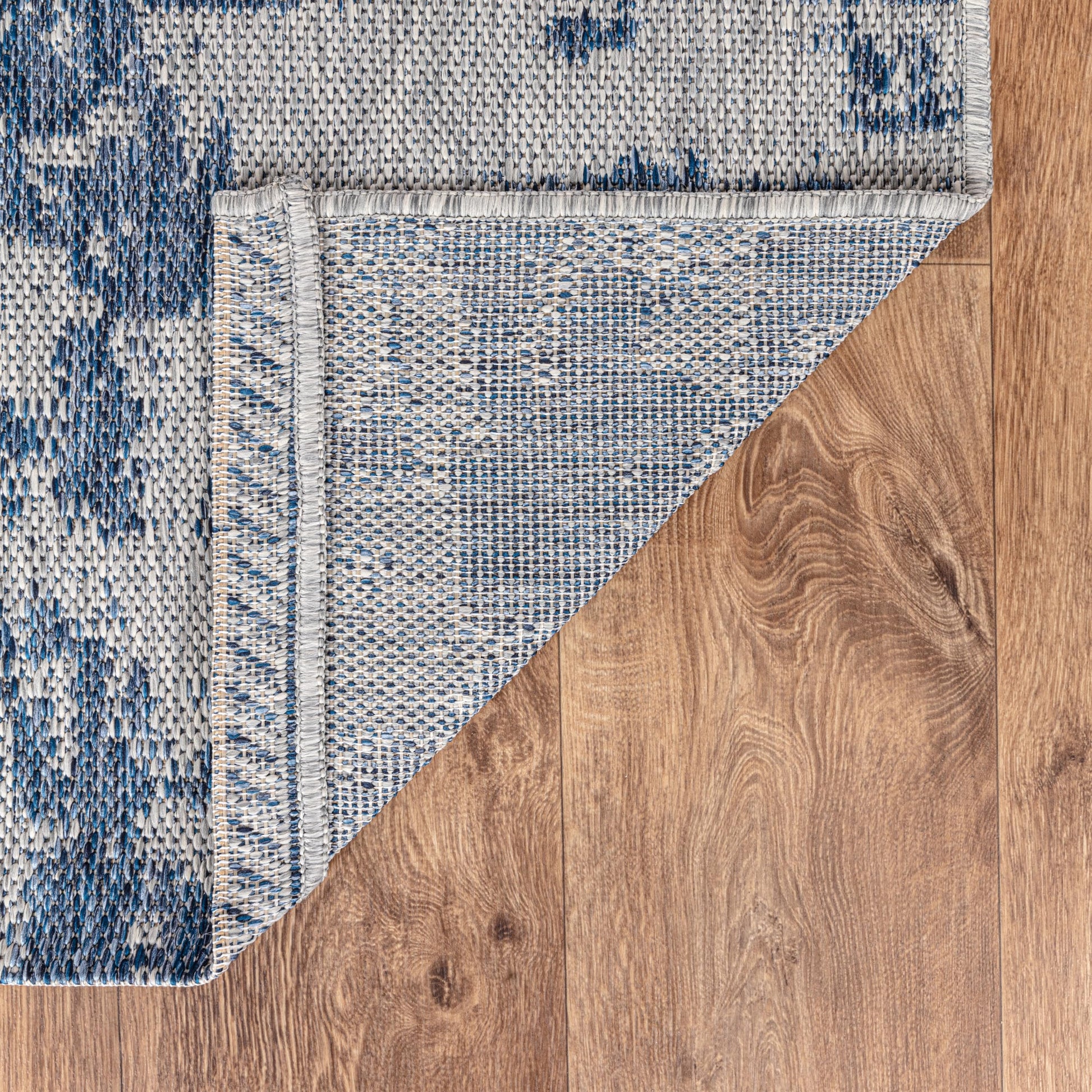 Modern abstract weatherproof rug beside swimming pool