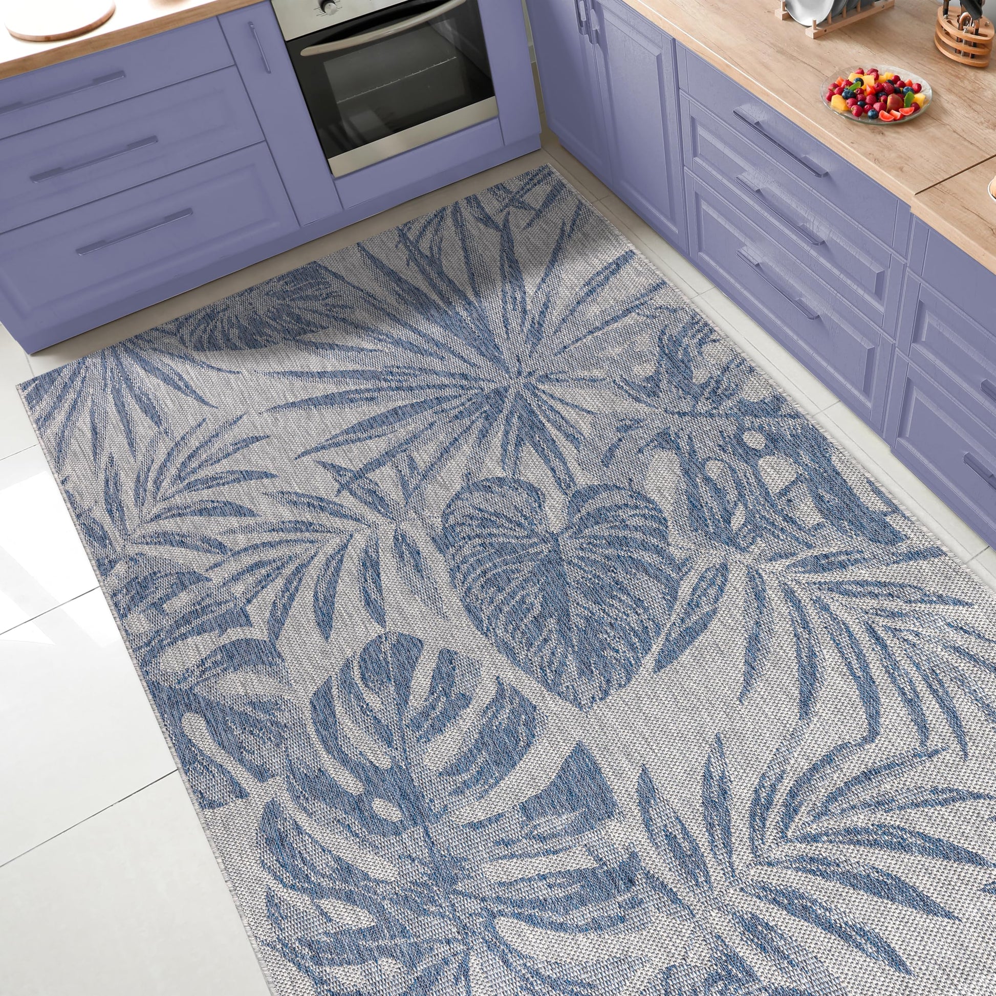 Tropical jungle outdoor rug under round patio dining table