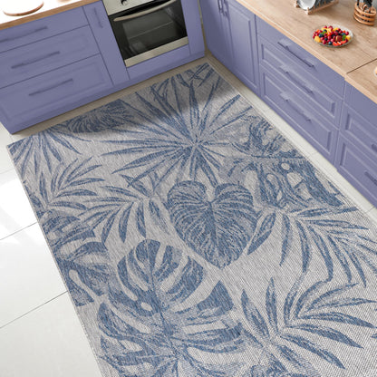Tropical jungle outdoor rug under round patio dining table